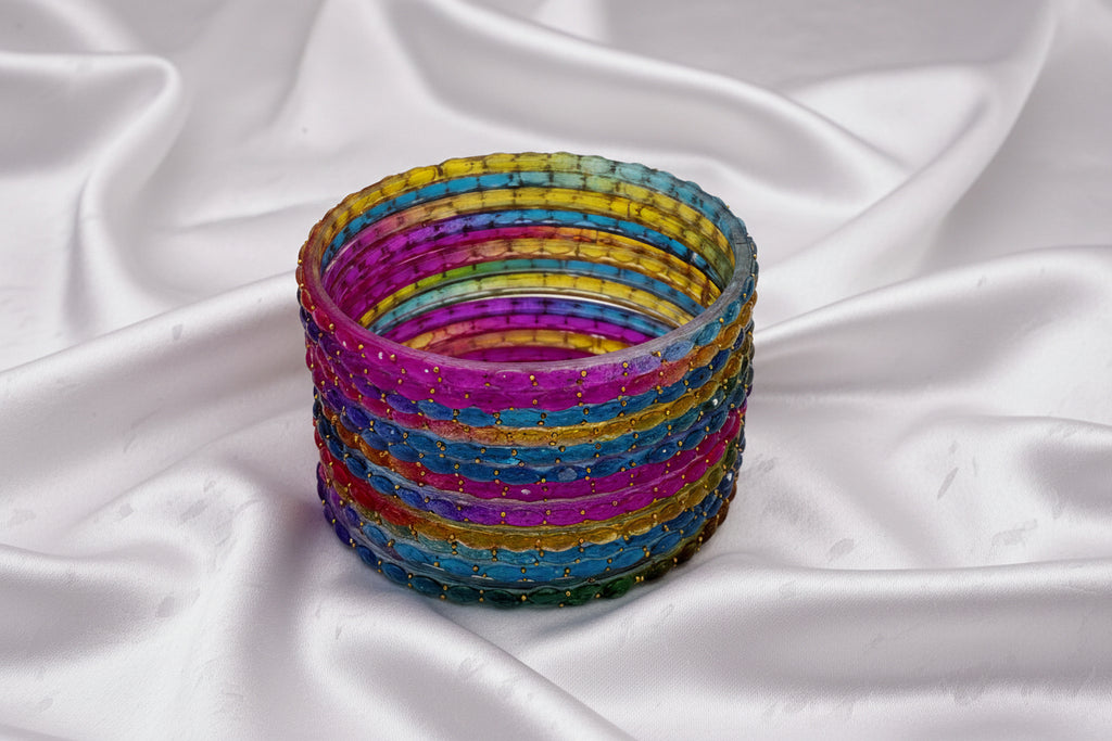 Stack of colorful bangles on a white background