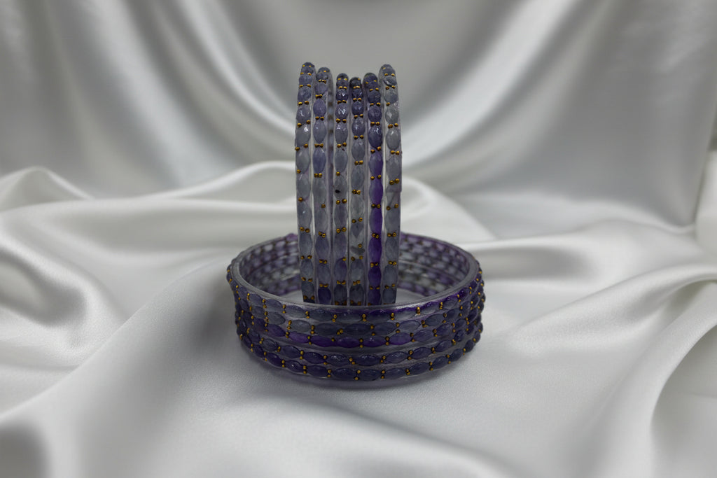 Beaded bracelet with a decorative stand on a gray background