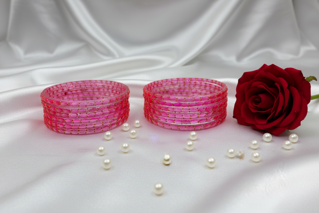 Two pink beaded bracelets on a white background